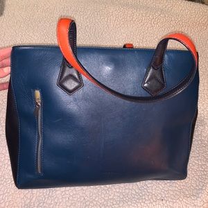 Navy blue tote with orange and yellow accents.